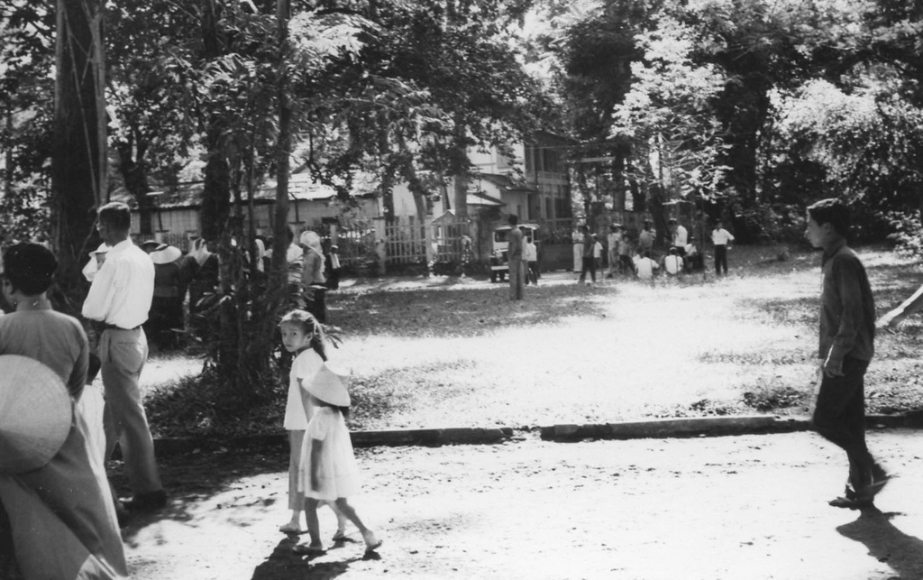 99A Police and army drive curious spectators from seeing exit of tunnel located at the basement of this deceiptive building at Saigon Zoo